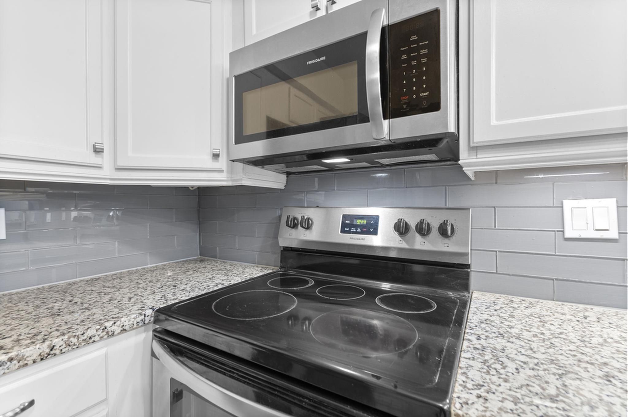 1271 Witte Road, Unit 26 Houston, TX 77055 - Photo 7 of 27 a stove top oven sitting inside of a kitchen