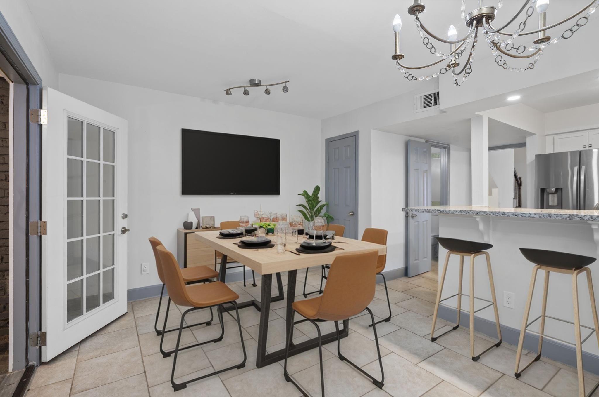 1271 Witte Road, Unit 26 Houston, TX 77055 - Photo 10 of 27 a view of a dining room with furniture and wooden floor