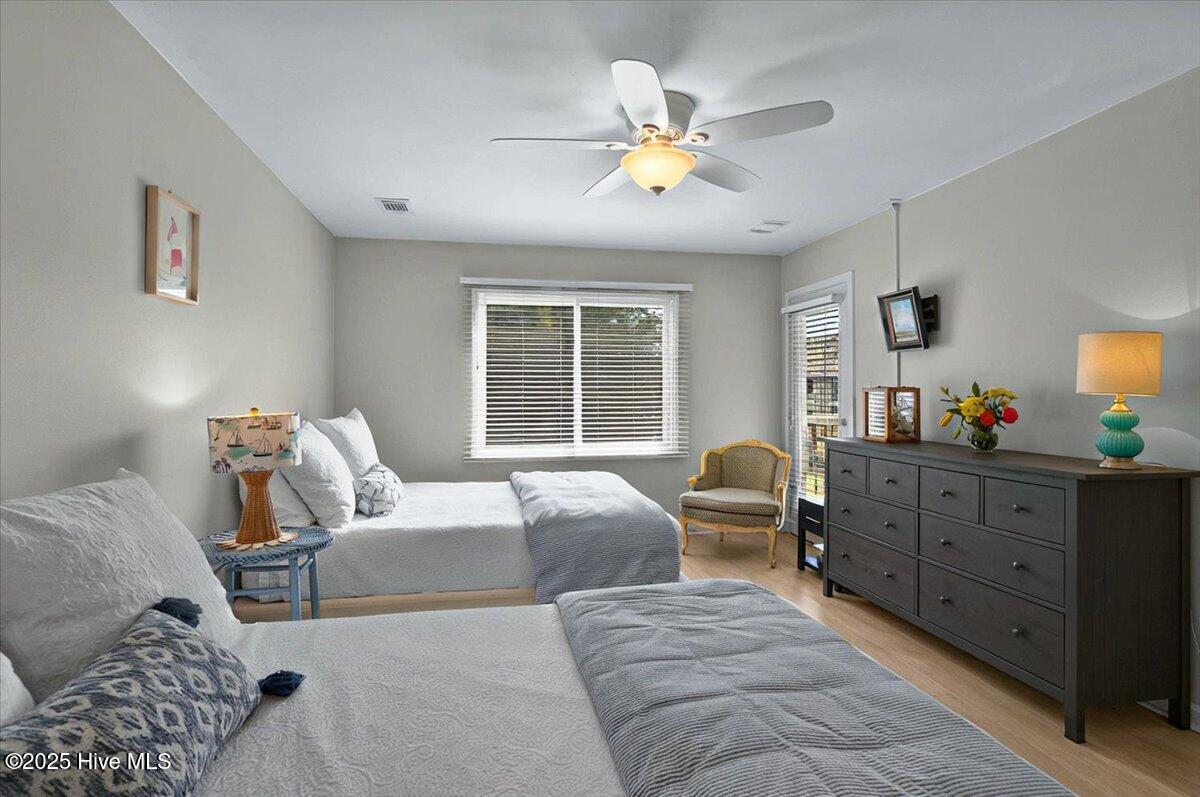 816 Colony Place, Unit D Sunset Beach, NC 28468 - Photo 16 of 51 Primary Bedroom opens to covered deck