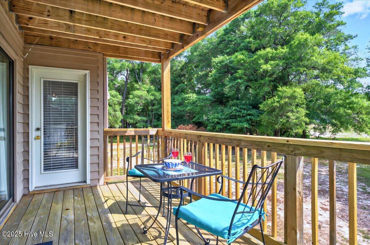 816 Colony Place, Unit D Sunset Beach, NC 28468 - Photo 28 of 51 Deck off of Living Room and Primary Bedroom
