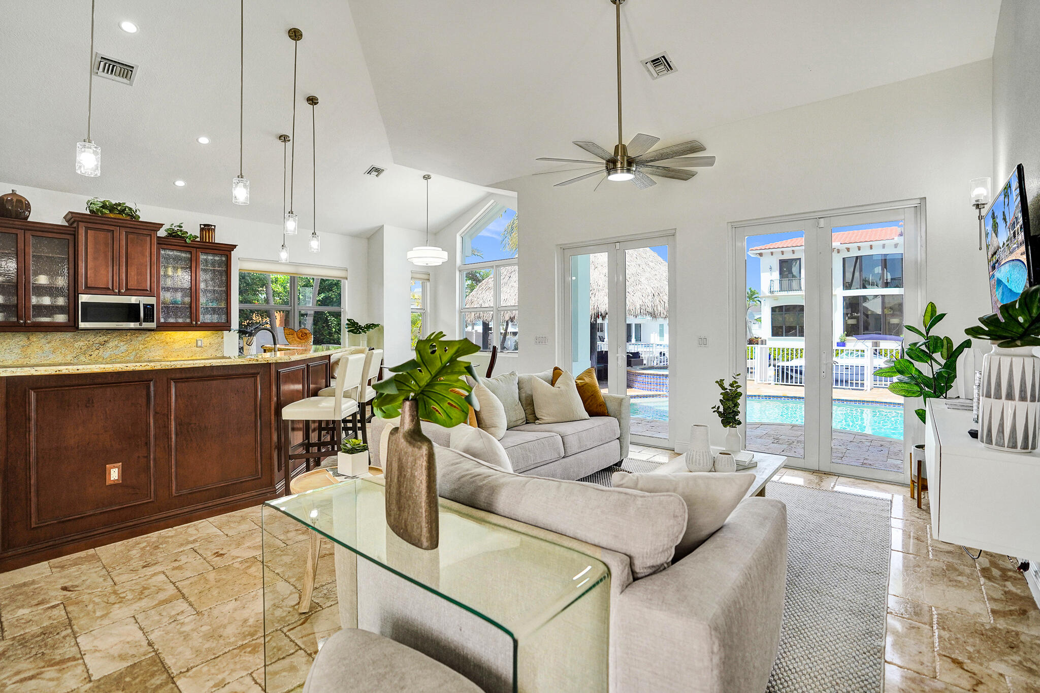 785 Northeast 71st Street Boca Raton, FL 33487 - Photo 13 of 62 a living room with kitchen island furniture and a chandelier