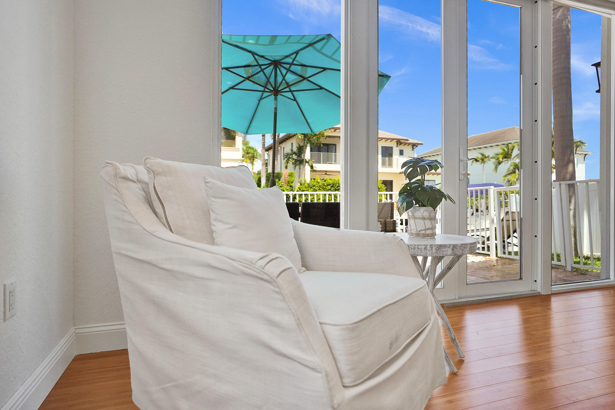 785 Northeast 71st Street Boca Raton, FL 33487 - Photo 26 of 62 a living room with furniture and a floor to ceiling window