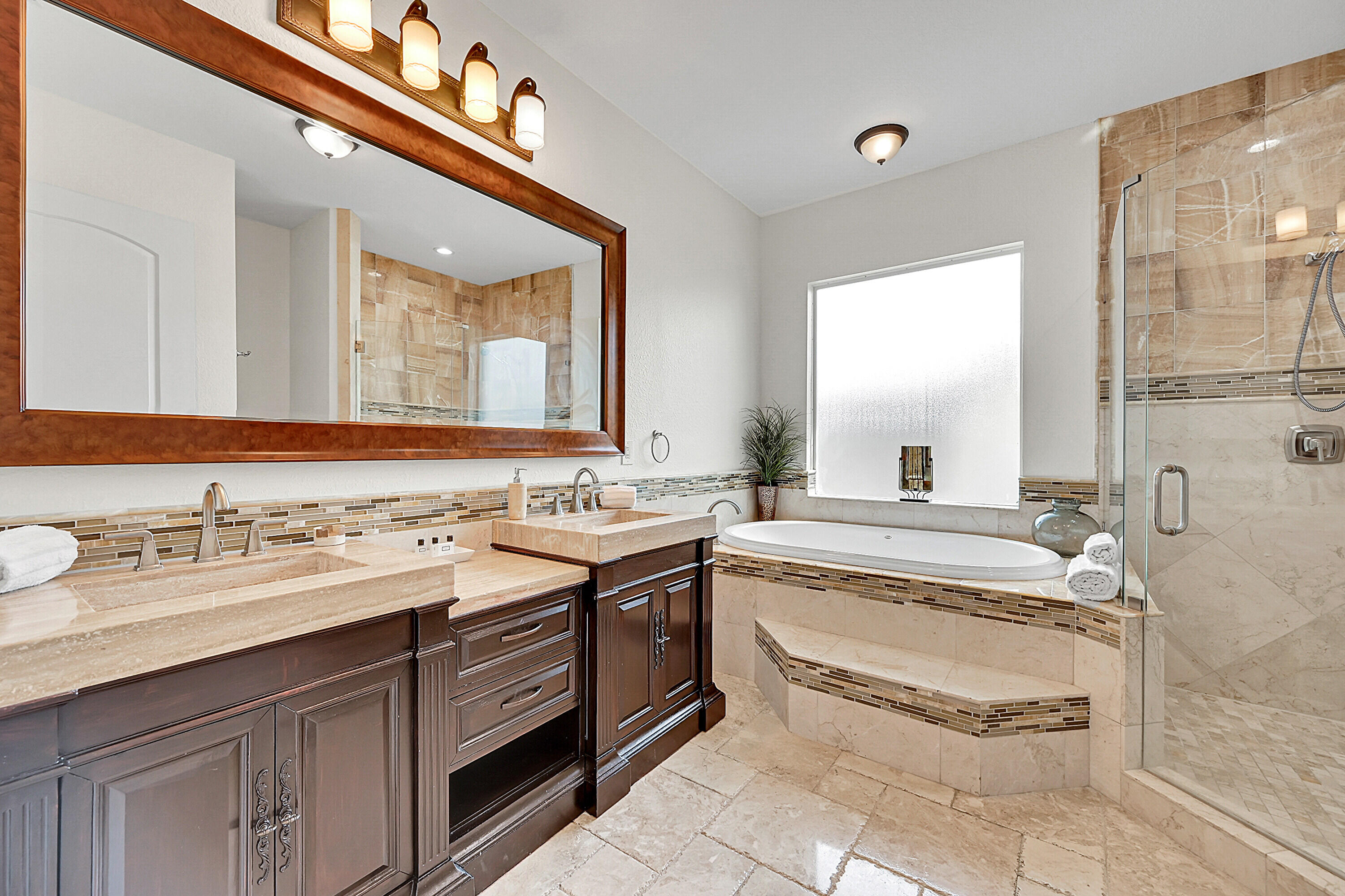 785 Northeast 71st Street Boca Raton, FL 33487 - Photo 27 of 62 a spacious bathroom with a granite countertop sink mirror and a