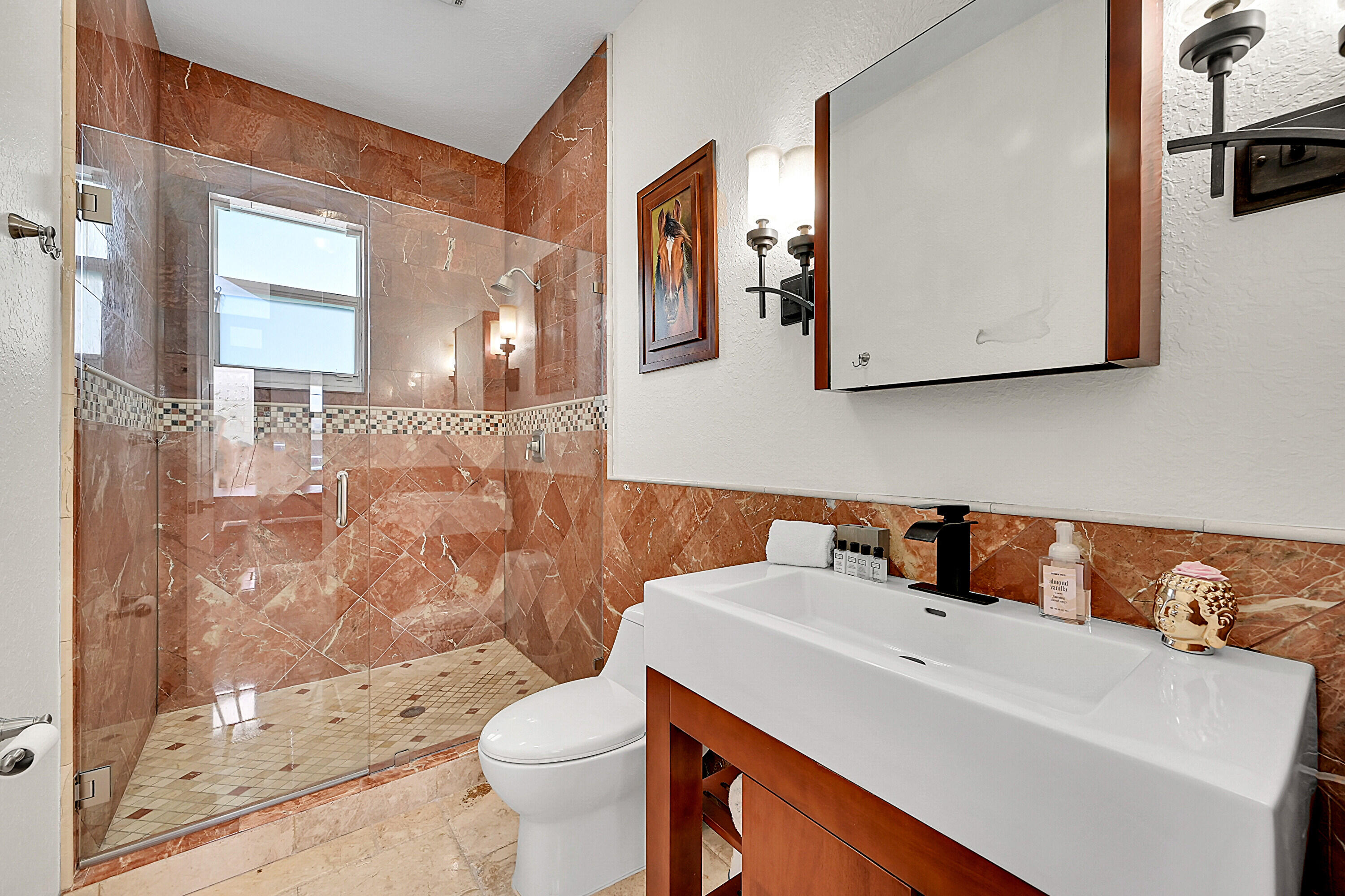785 Northeast 71st Street Boca Raton, FL 33487 - Photo 32 of 62 a bathroom with a sink and a mirror