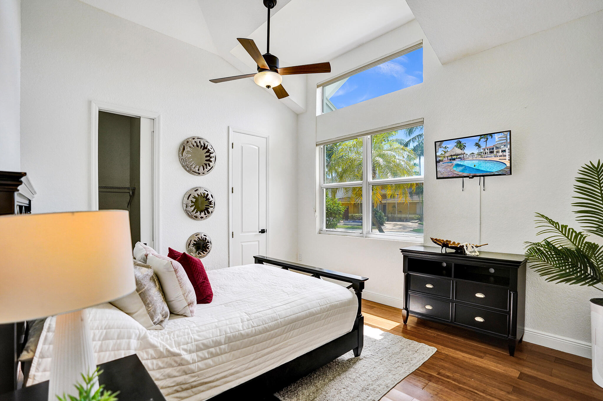 785 Northeast 71st Street Boca Raton, FL 33487 - Photo 33 of 62 a bedroom with a bed and a window