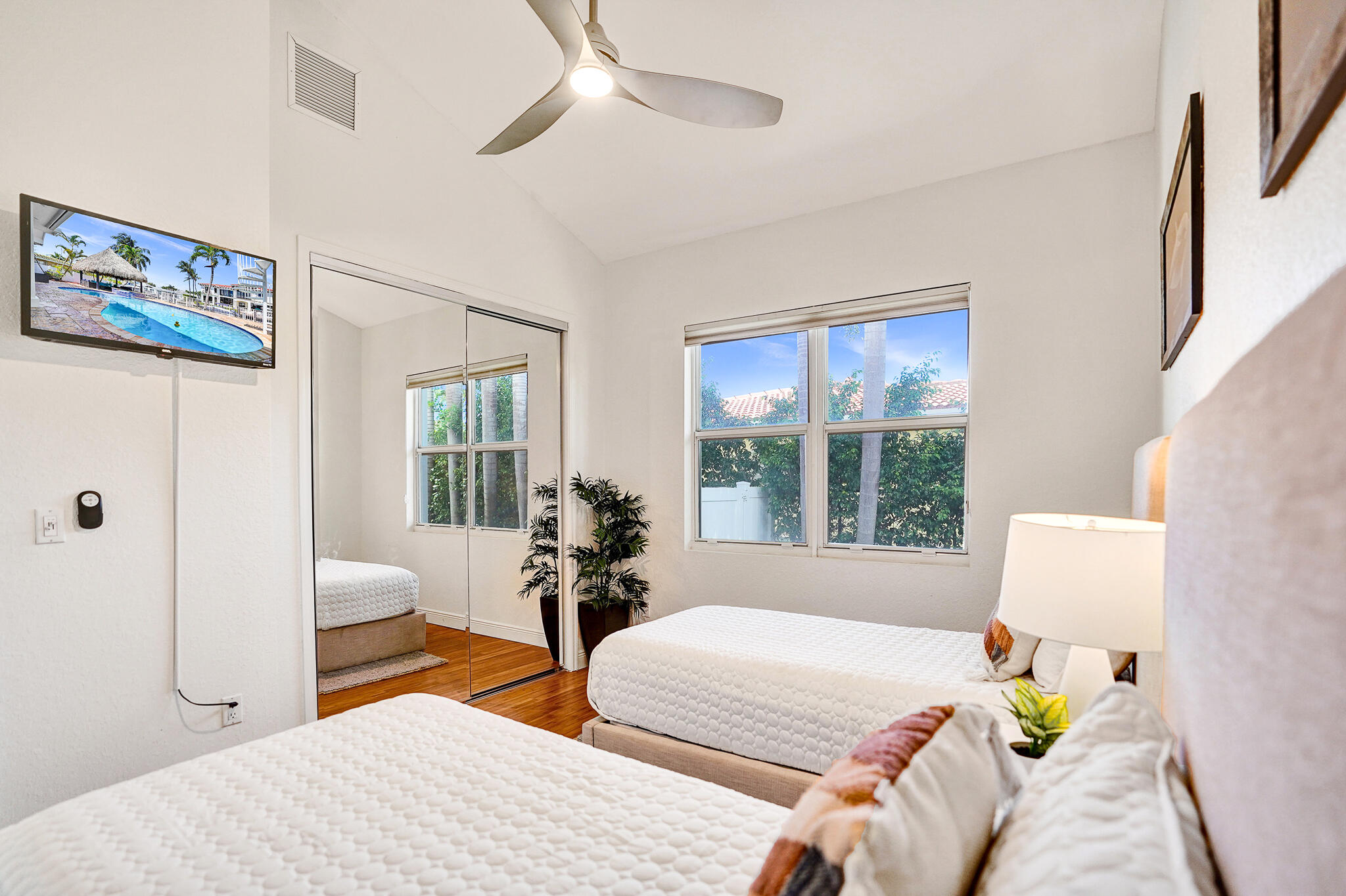785 Northeast 71st Street Boca Raton, FL 33487 - Photo 35 of 62 a bedroom with two beds and a large window