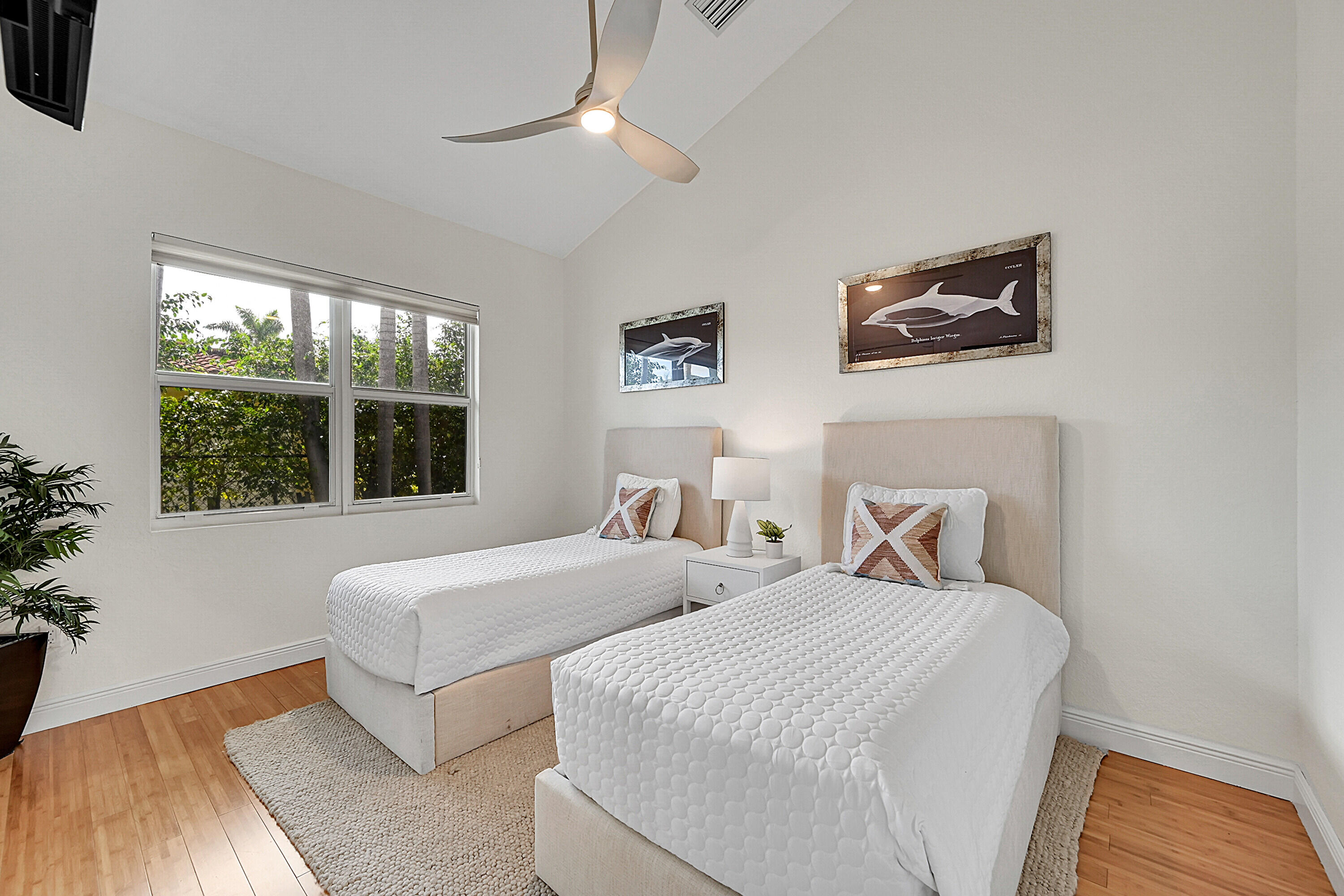 785 Northeast 71st Street Boca Raton, FL 33487 - Photo 36 of 62 a bedroom with two beds and a large window