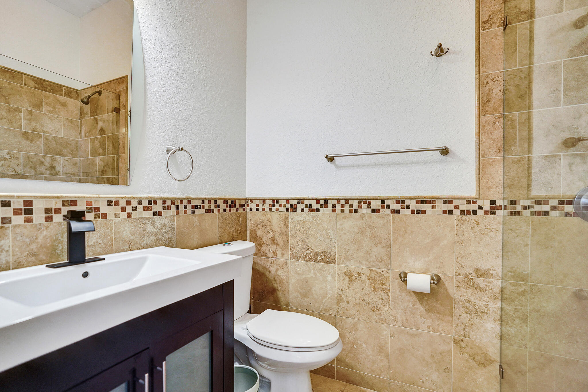 785 Northeast 71st Street Boca Raton, FL 33487 - Photo 37 of 62 a bathroom with a sink a toilet and mirror