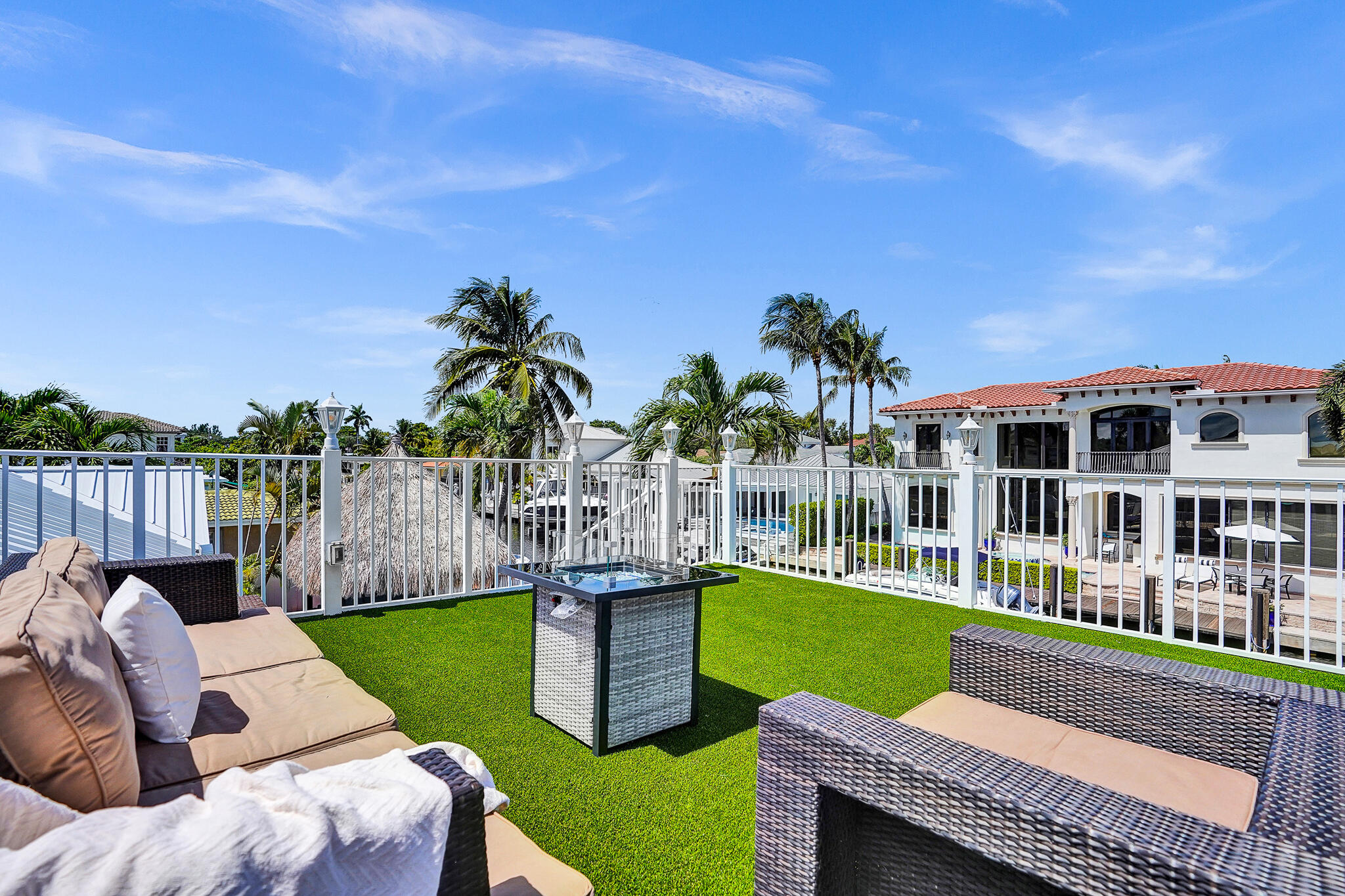 785 Northeast 71st Street Boca Raton, FL 33487 - Photo 49 of 62 a view of a house with a patio and a yard