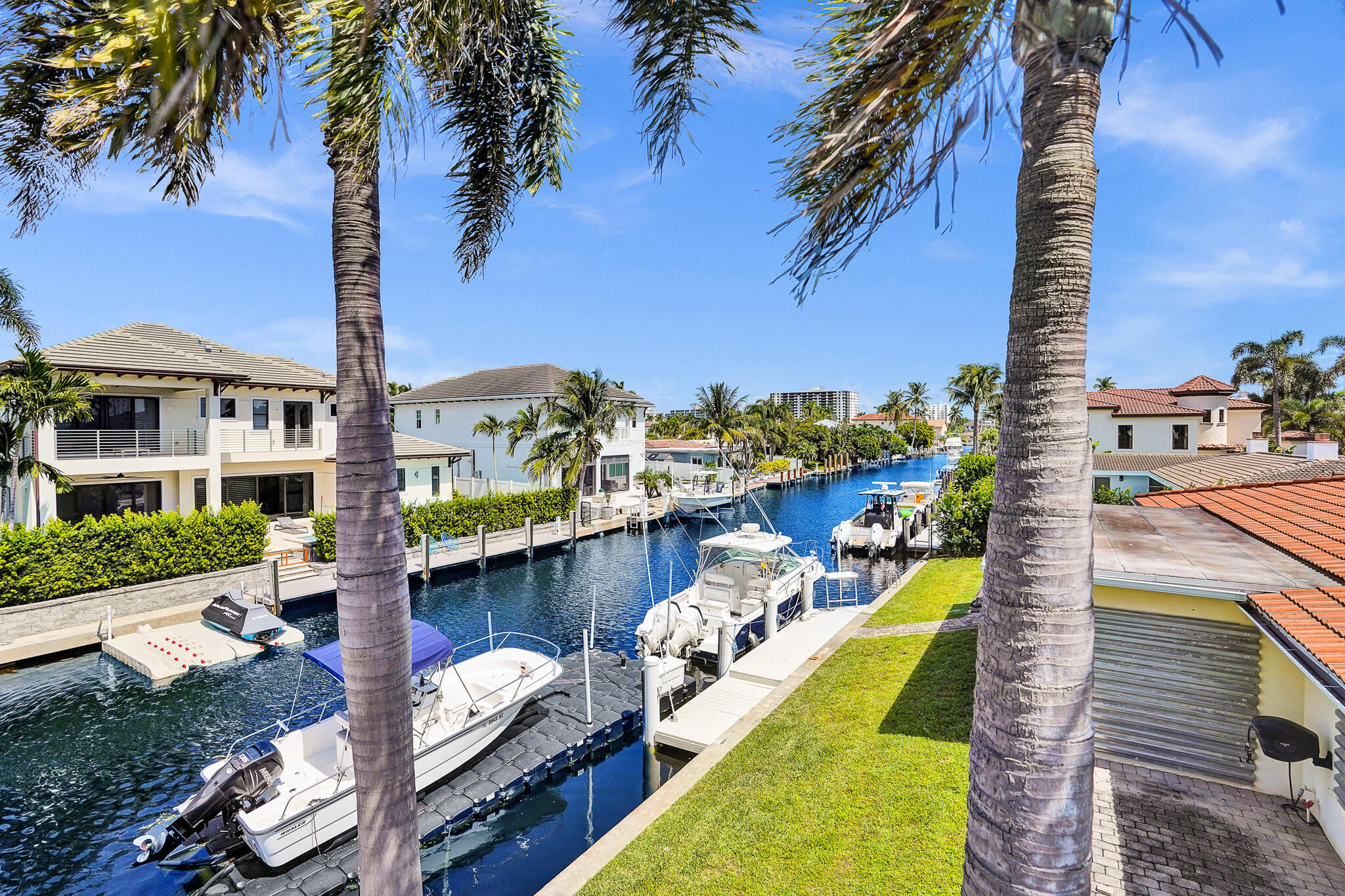 785 Northeast 71st Street Boca Raton, FL 33487 - Photo 51 of 62 a view of a house with a swimming pool outdoor seating