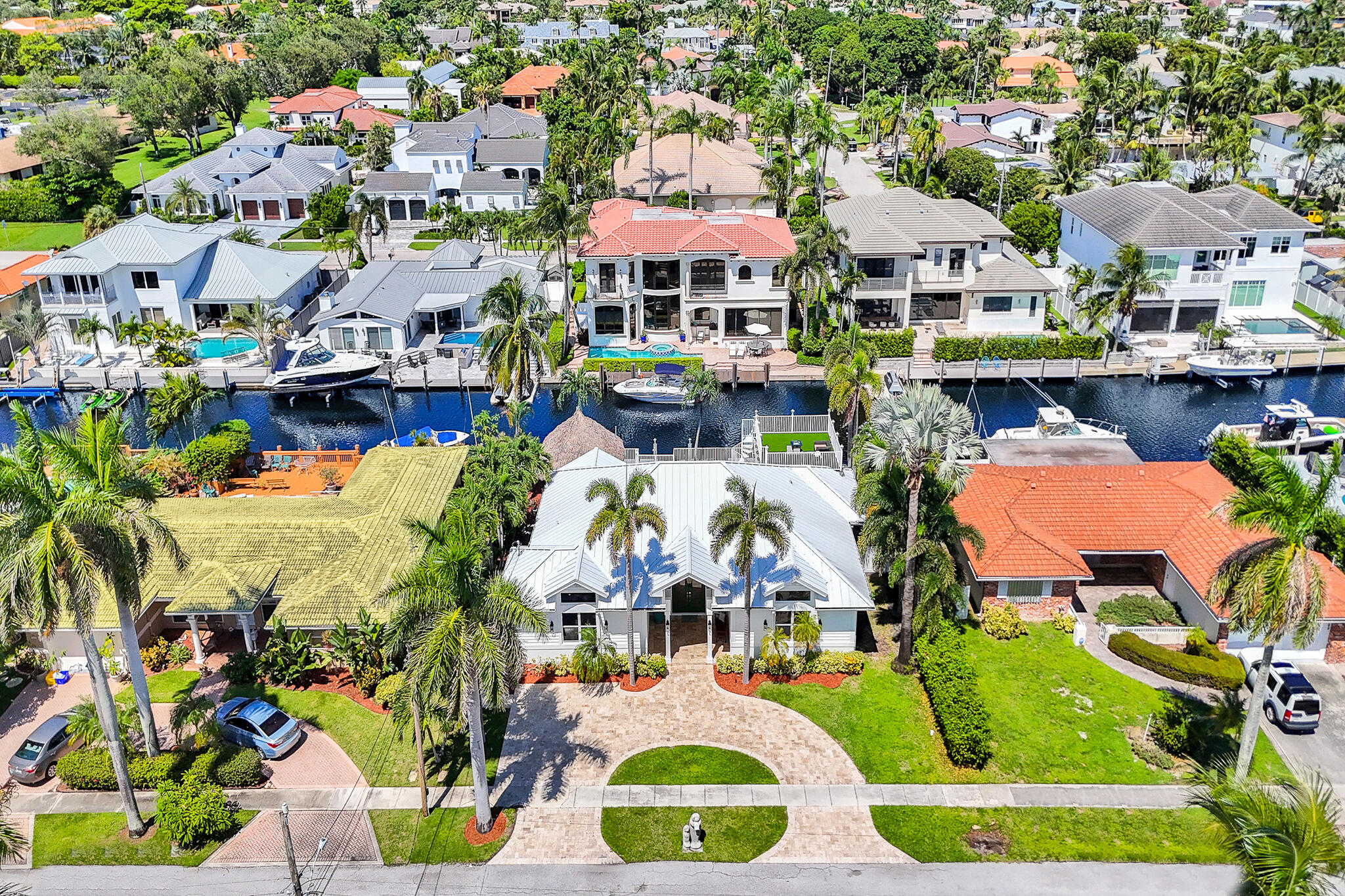 785 Northeast 71st Street Boca Raton, FL 33487 - Photo 57 of 62 an aerial view of residential houses with outdoor space and swimming pool