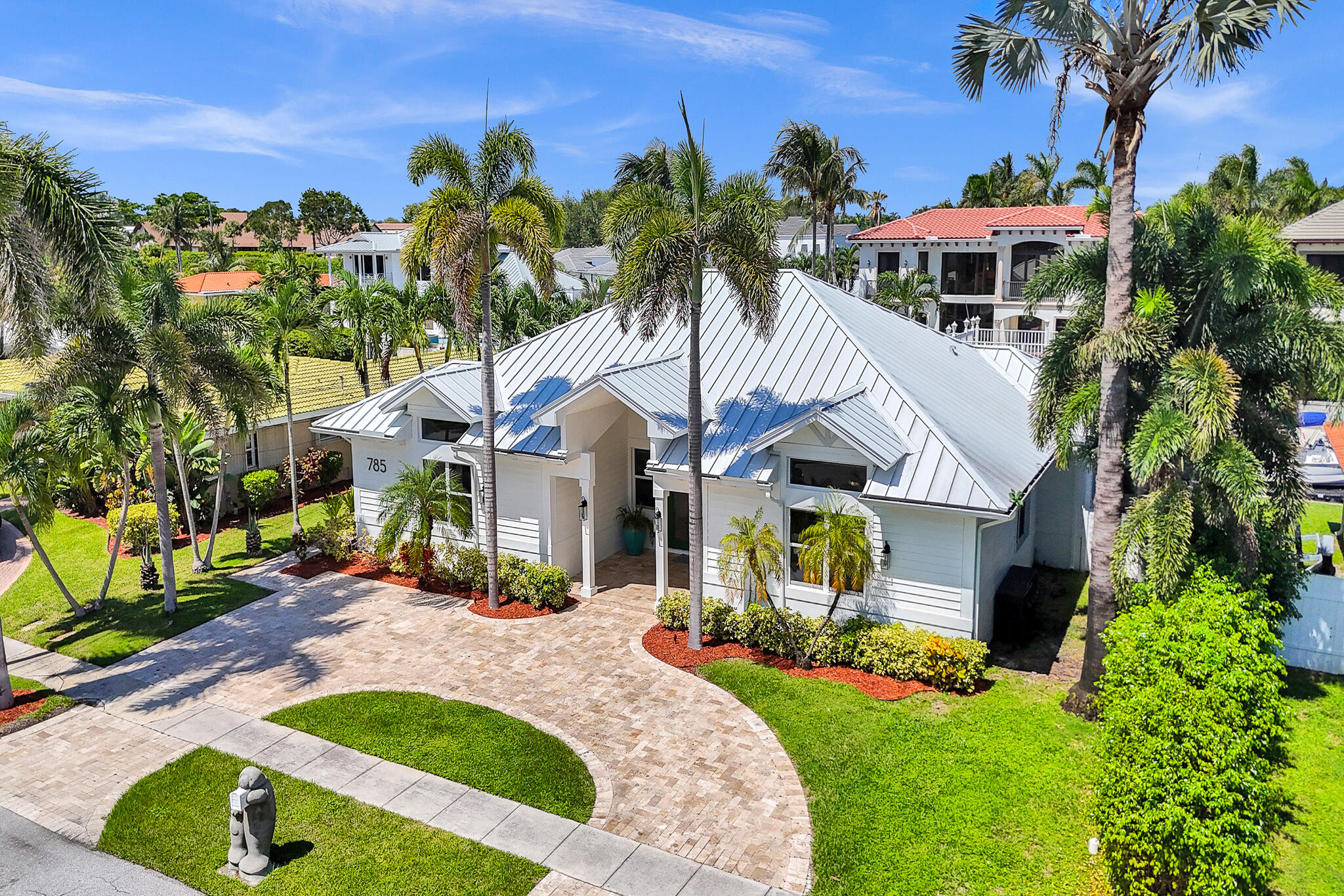 785 Northeast 71st Street Boca Raton, FL 33487 - Photo 59 of 62 a aerial view of a house with a yard and potted plants