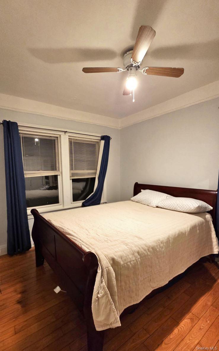 25-55 97th Street Queens, NY 11369 - Photo 3 of 15 a bedroom with a bed and a dresser