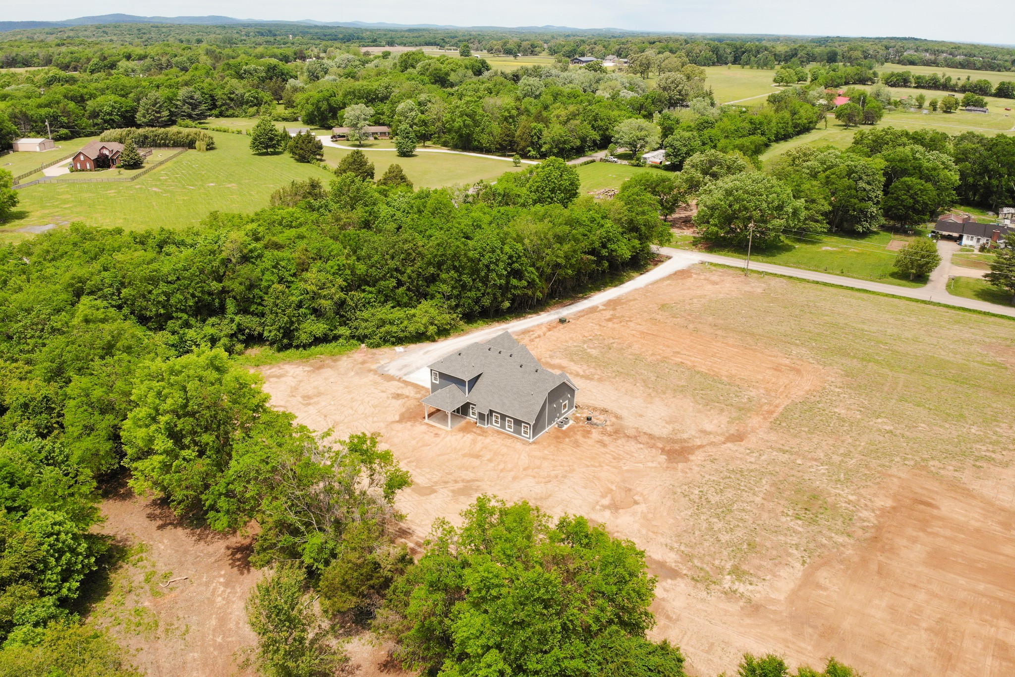 1581 Harrison Road Murfreesboro, TN 37128 - Photo 3 of 25 an aerial view of residential houses with outdoor space and trees