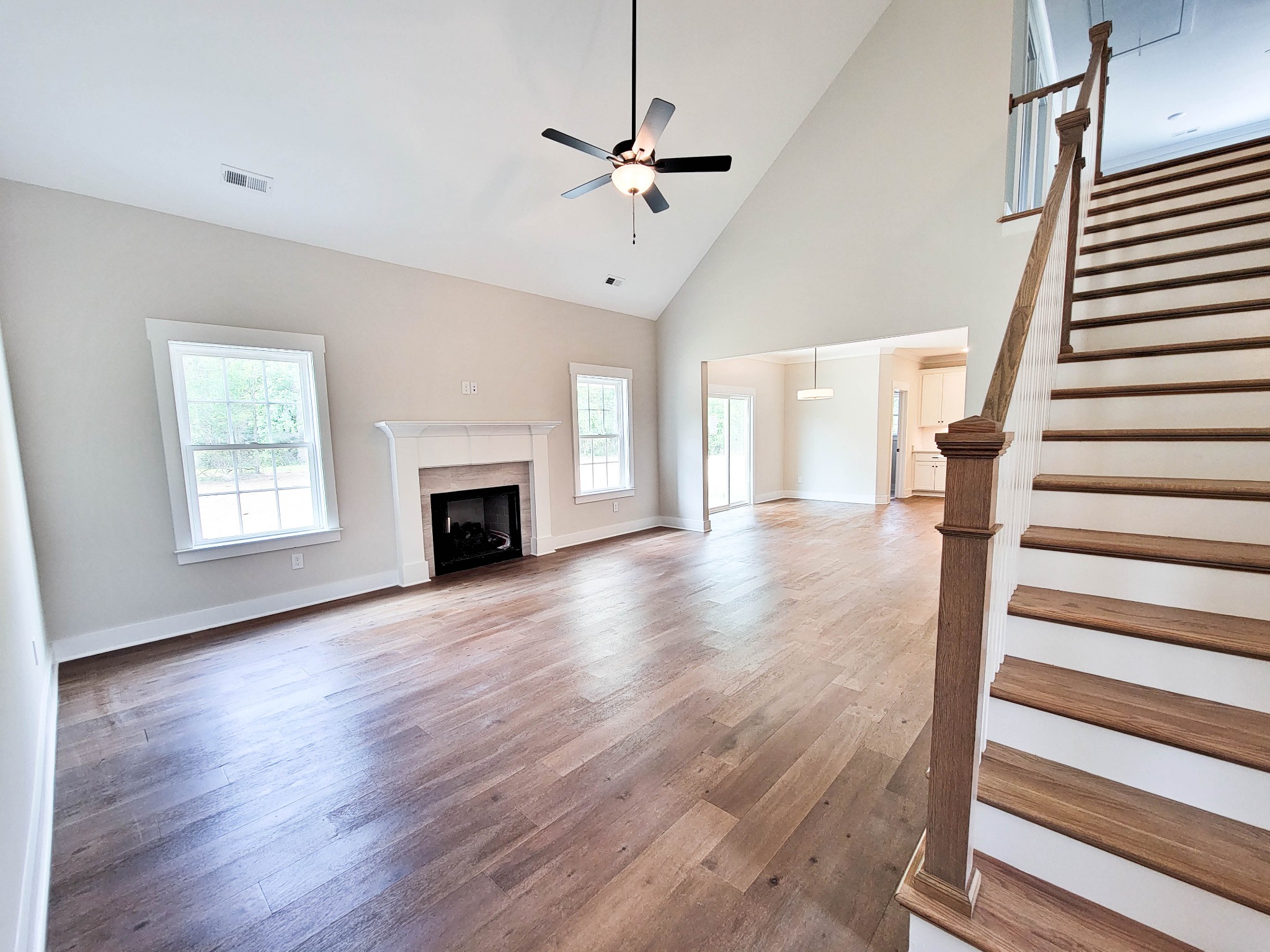 1581 Harrison Road Murfreesboro, TN 37128 - Photo 6 of 25 wooden floor in an empty room with a fireplace