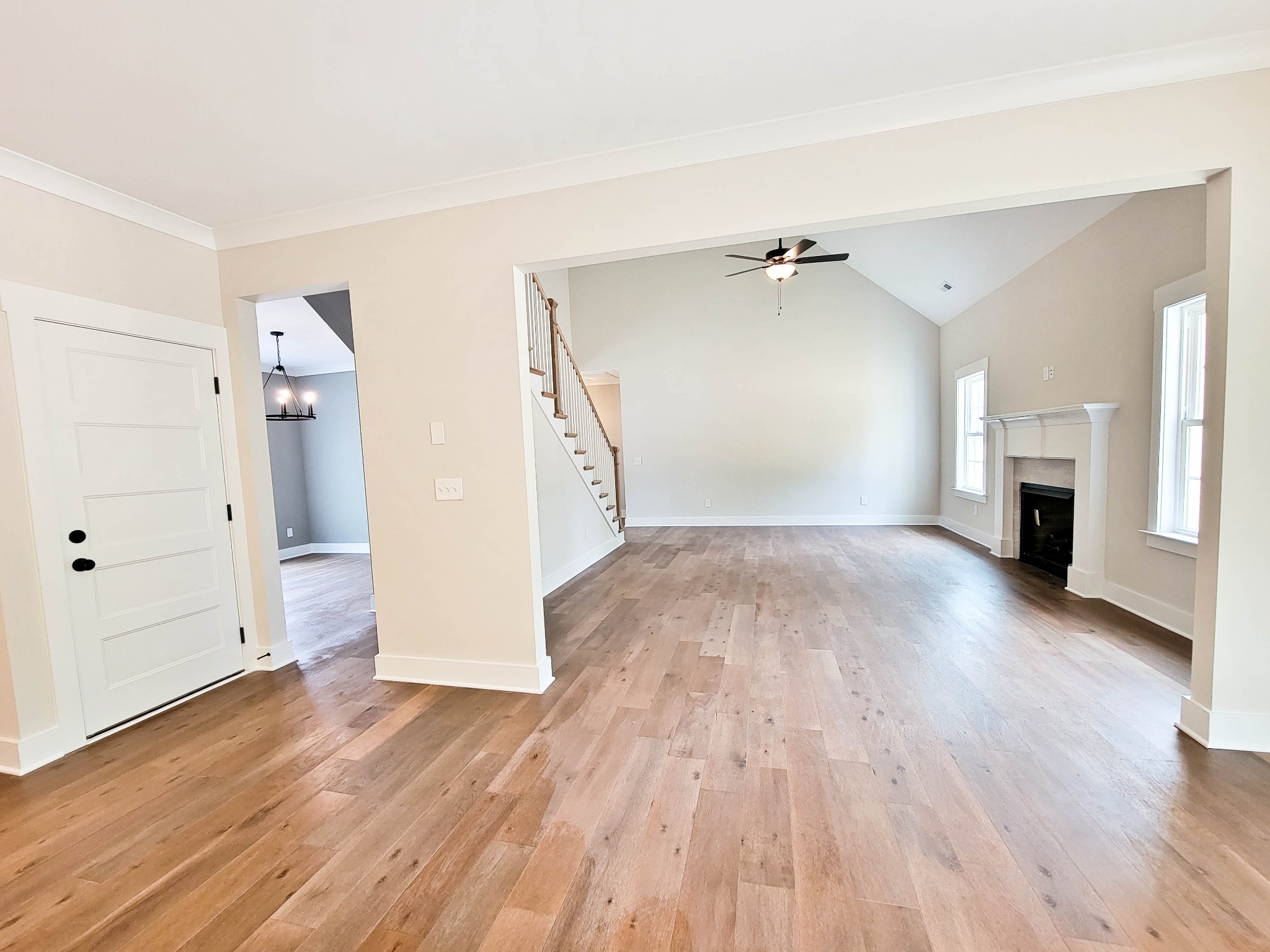 1581 Harrison Road Murfreesboro, TN 37128 - Photo 8 of 25 an empty room with wooden floor and a ceiling fan