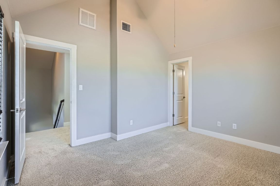 12200 Barras Branch Drive, Unit 135 Austin, TX 78748 - Photo 23 of 31 a view of an empty room with closet and a bathroom