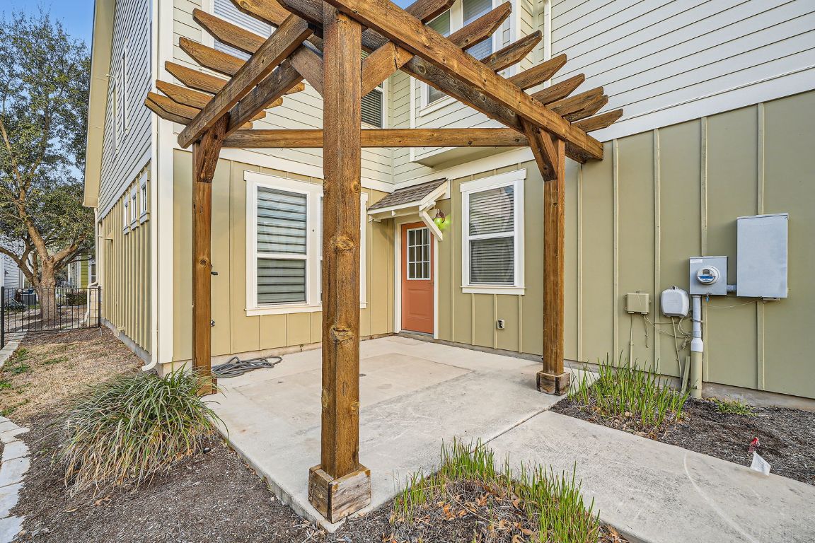 12200 Barras Branch Drive, Unit 135 Austin, TX 78748 - Photo 28 of 31 a front view of a house with a garden