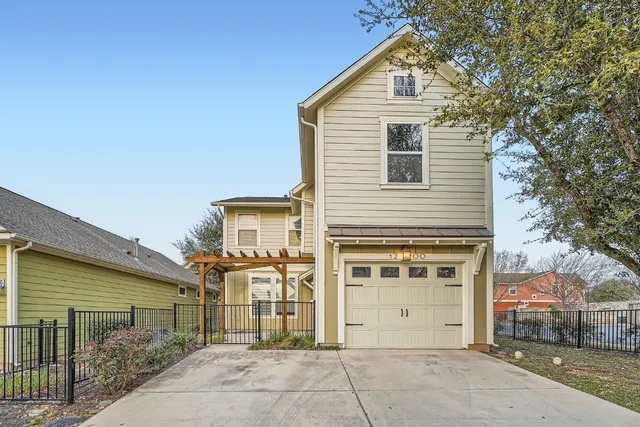 a front view of a house with a garage