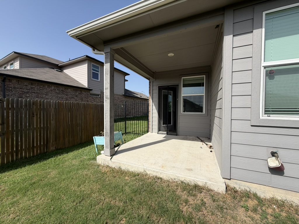 10708 Gonzales Ranger Pass Austin, TX 78754 - Photo 10 of 40 An inviting covered patio offers a cool retreat in the fenced yard.