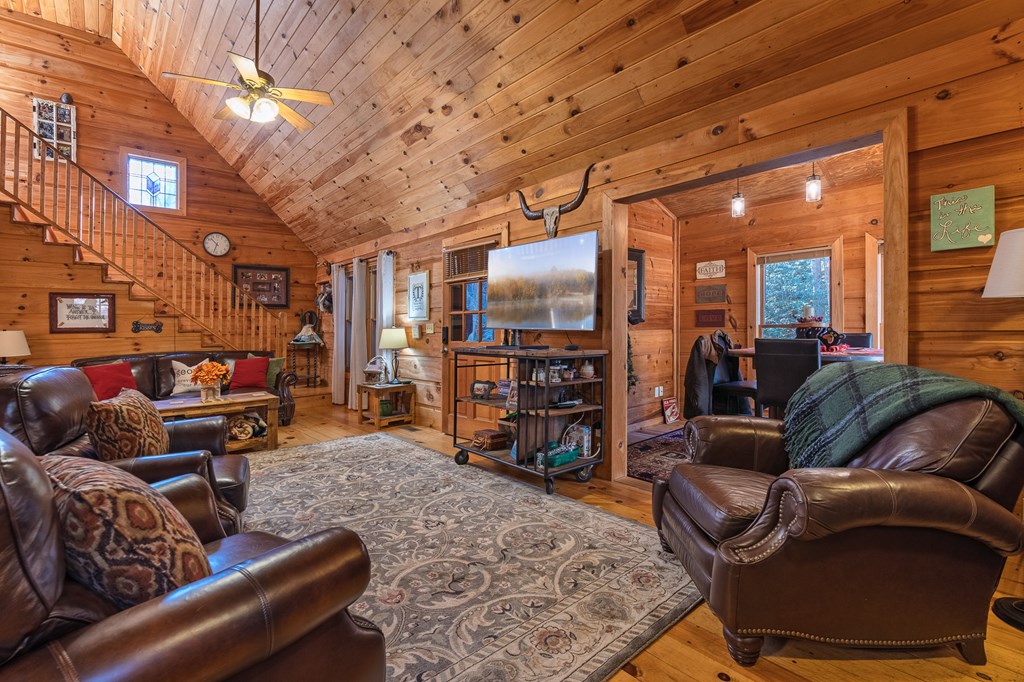 659 Kells Ridge Drive Ellijay, GA 30540 - Photo 17 of 41 a living room with furniture and a flat screen tv