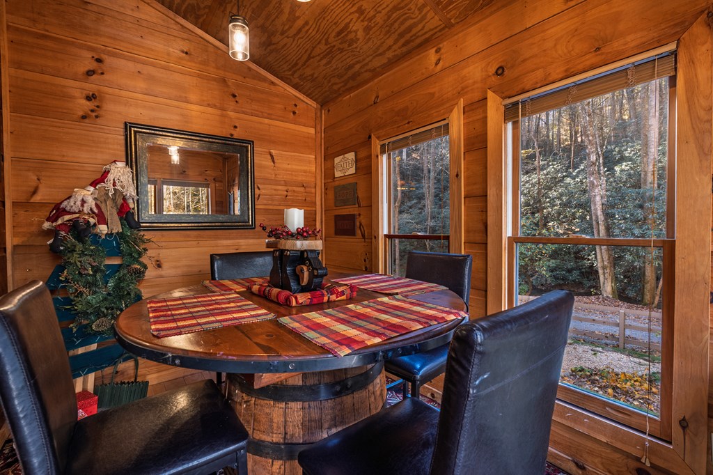 659 Kells Ridge Drive Ellijay, GA 30540 - Photo 19 of 41 a view of a dining room with furniture window and wooden floor