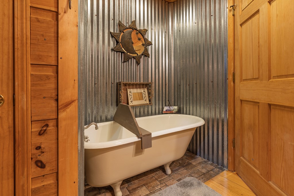 659 Kells Ridge Drive Ellijay, GA 30540 - Photo 22 of 41 a bathroom with a sink and mirror