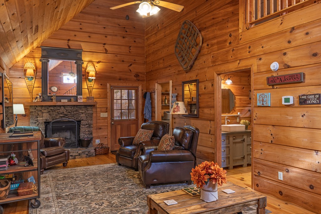 659 Kells Ridge Drive Ellijay, GA 30540 - Photo 28 of 41 a living room with furniture and a fireplace