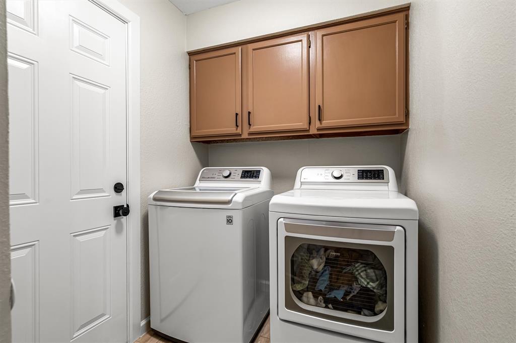 2113 Garner Court Rowlett, TX 75088 - Photo 18 of 40 a utility room with dryer and washer