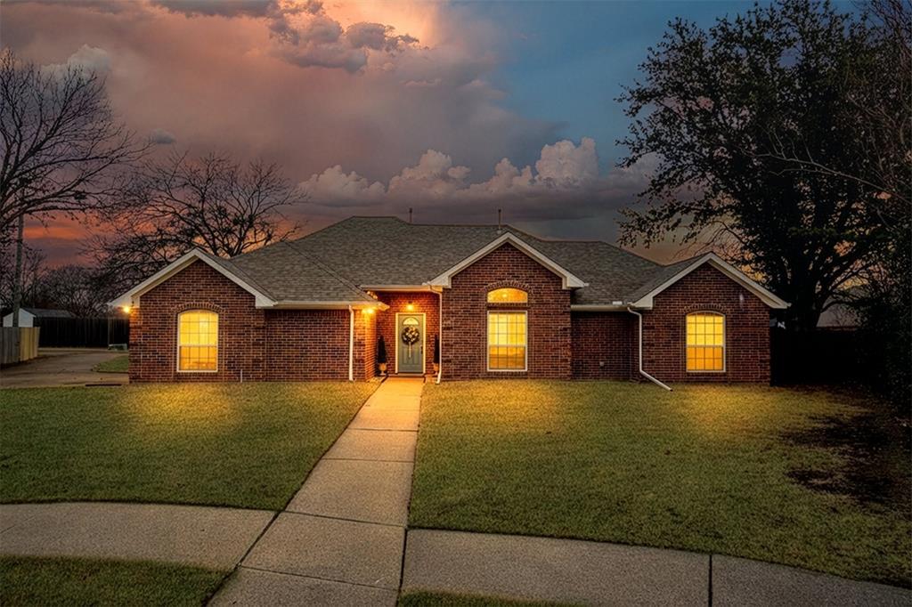 2113 Garner Court Rowlett, TX 75088 - Photo 3 of 40 a front view of a house with a yard and garage