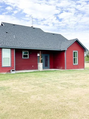 a house view with a garden space