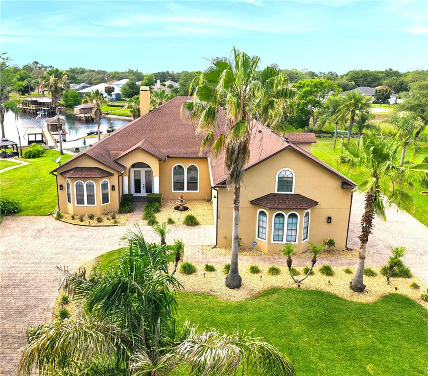 11325 Preston Cove Road Clermont, FL 34711 - Photo 2 of 58 a aerial view of a house with yard porch and furniture