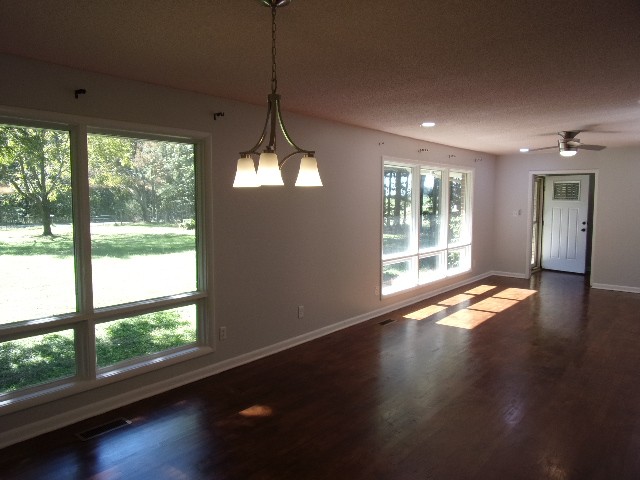 3231 State Line Road Taft, TN 38488 - Photo 2 of 26 a view of empty room with wooden floor and fan