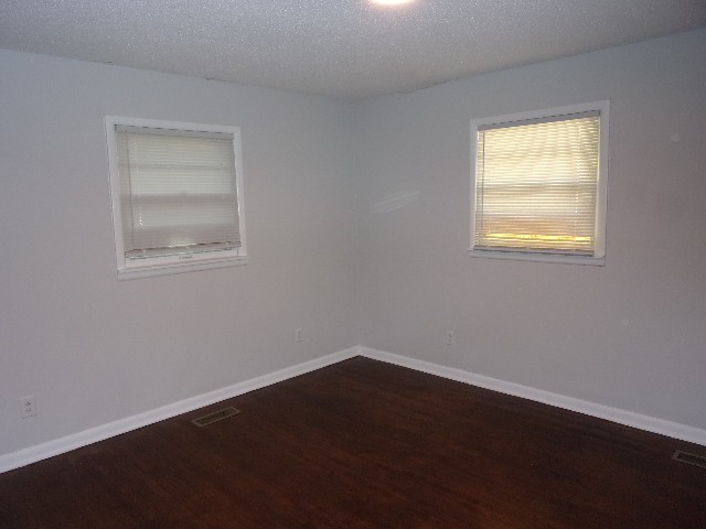 3231 State Line Road Taft, TN 38488 - Photo 12 of 26 a view of an empty room with wooden floor and a window