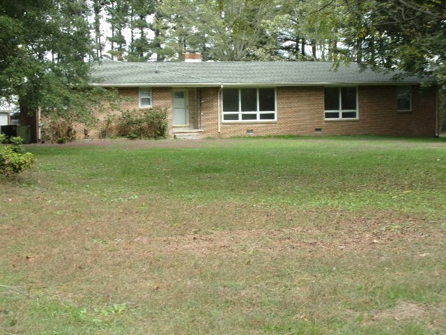 3231 State Line Road Taft, TN 38488 - Photo 26 of 26 a front view of a house with garden
