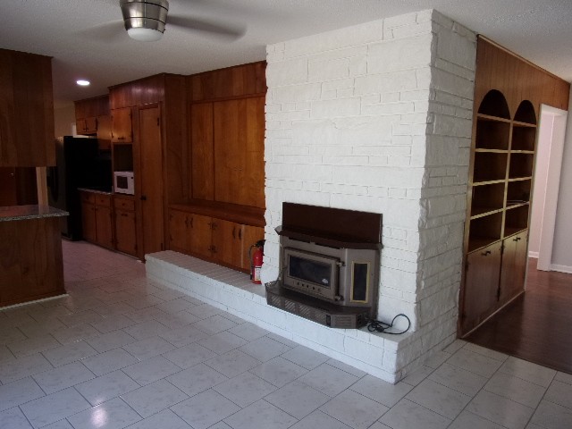 3231 State Line Road Taft, TN 38488 - Photo 6 of 26 a kitchen with granite countertop a refrigerator and a stove top oven