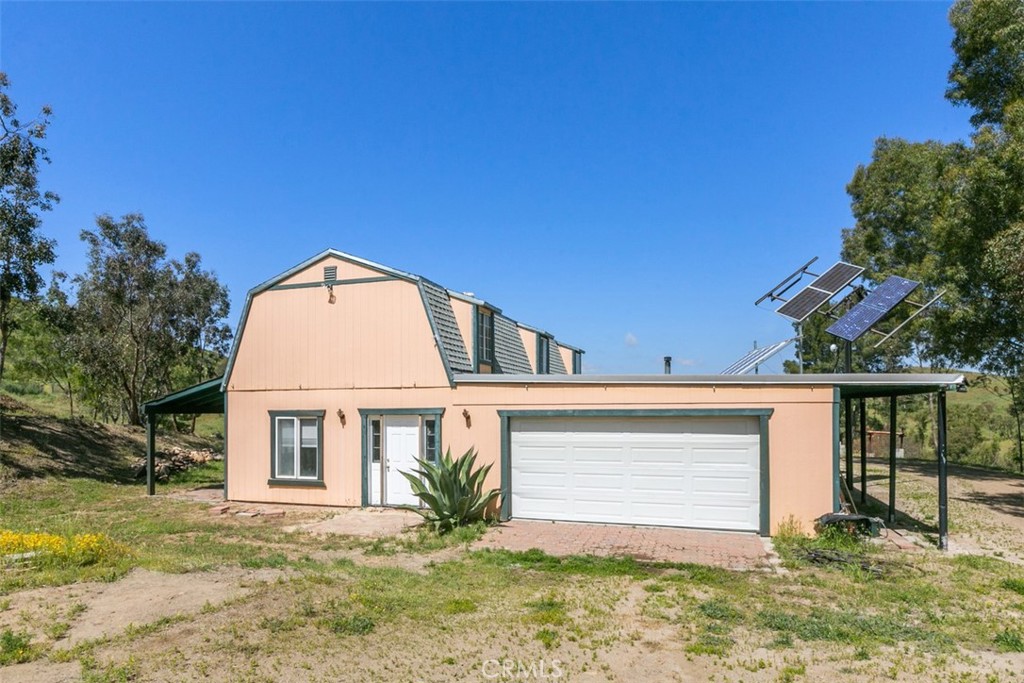35175 Hidden Falls Road Winchester, CA 92596 - Photo 1 of 1 a front view of a house with a yard and garage