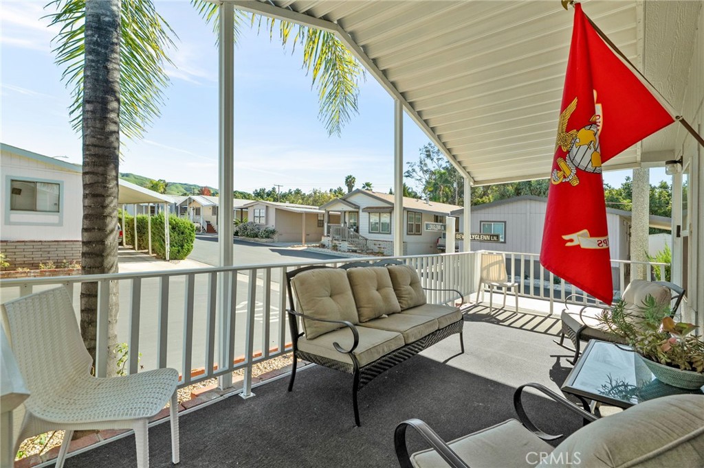 2140 Mentone, Unit 153 Mentone, CA 92359 - Photo 3 of 42 a balcony with furniture and a potted plant