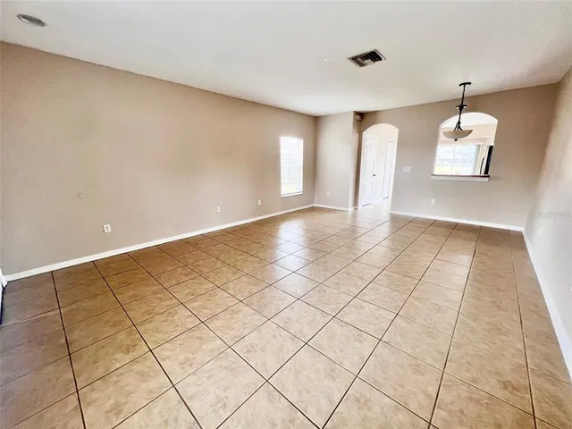 a view of an empty room and window
