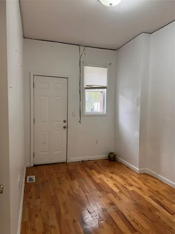 wooden floor and window in a room