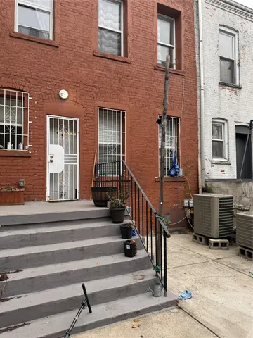 a view of a building with a window and stairs
