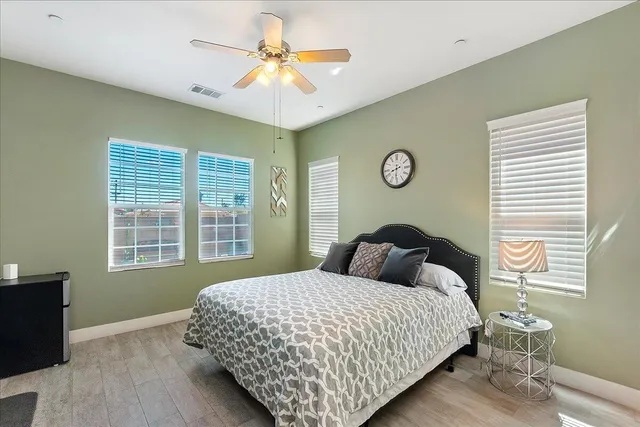 a bedroom with a large bed and a window