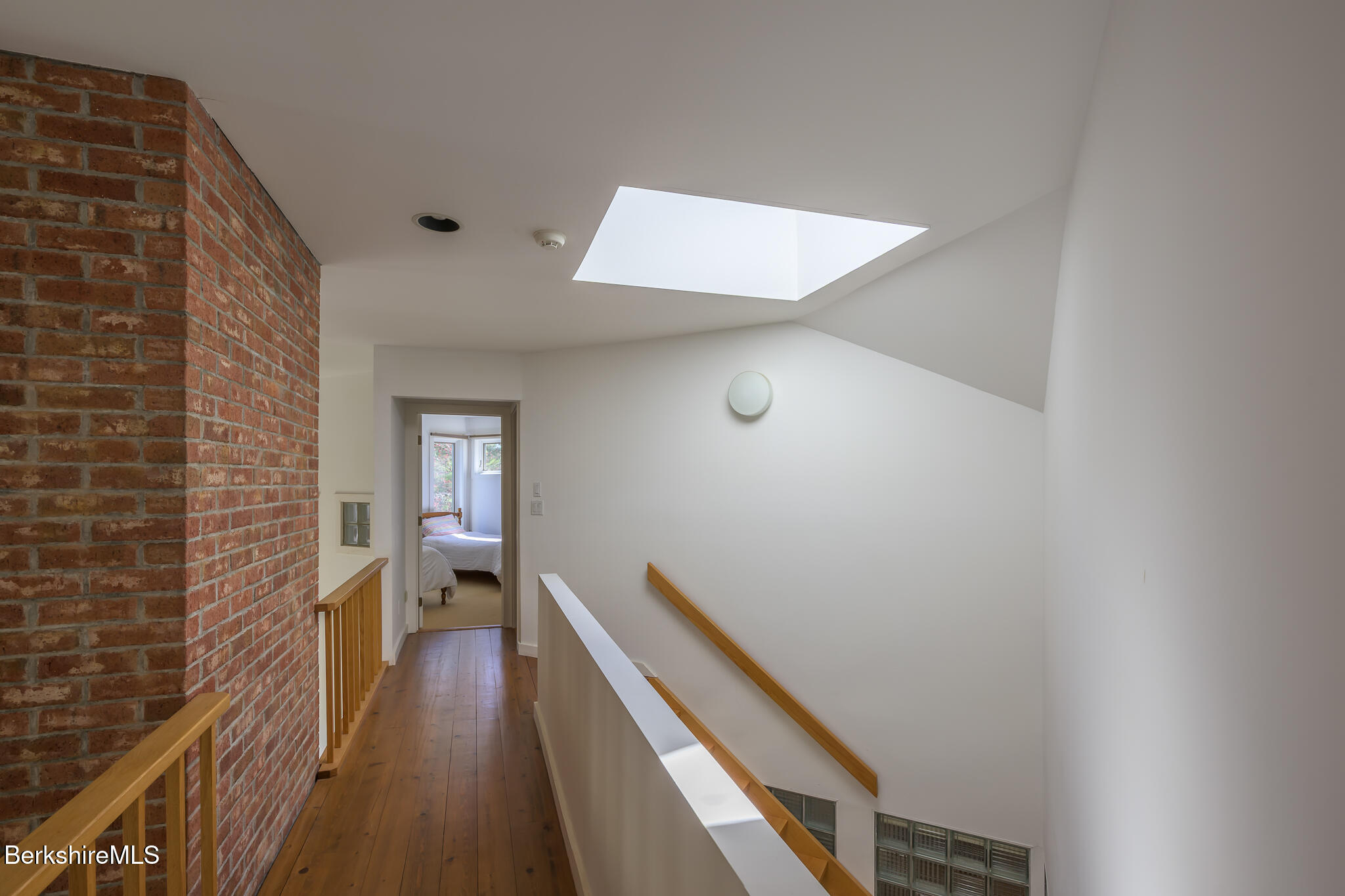 415 Brewer Branch Road New Marlborough, MA 01259 - Photo 41 of 65 a view of a hallway with wooden floor and staircase