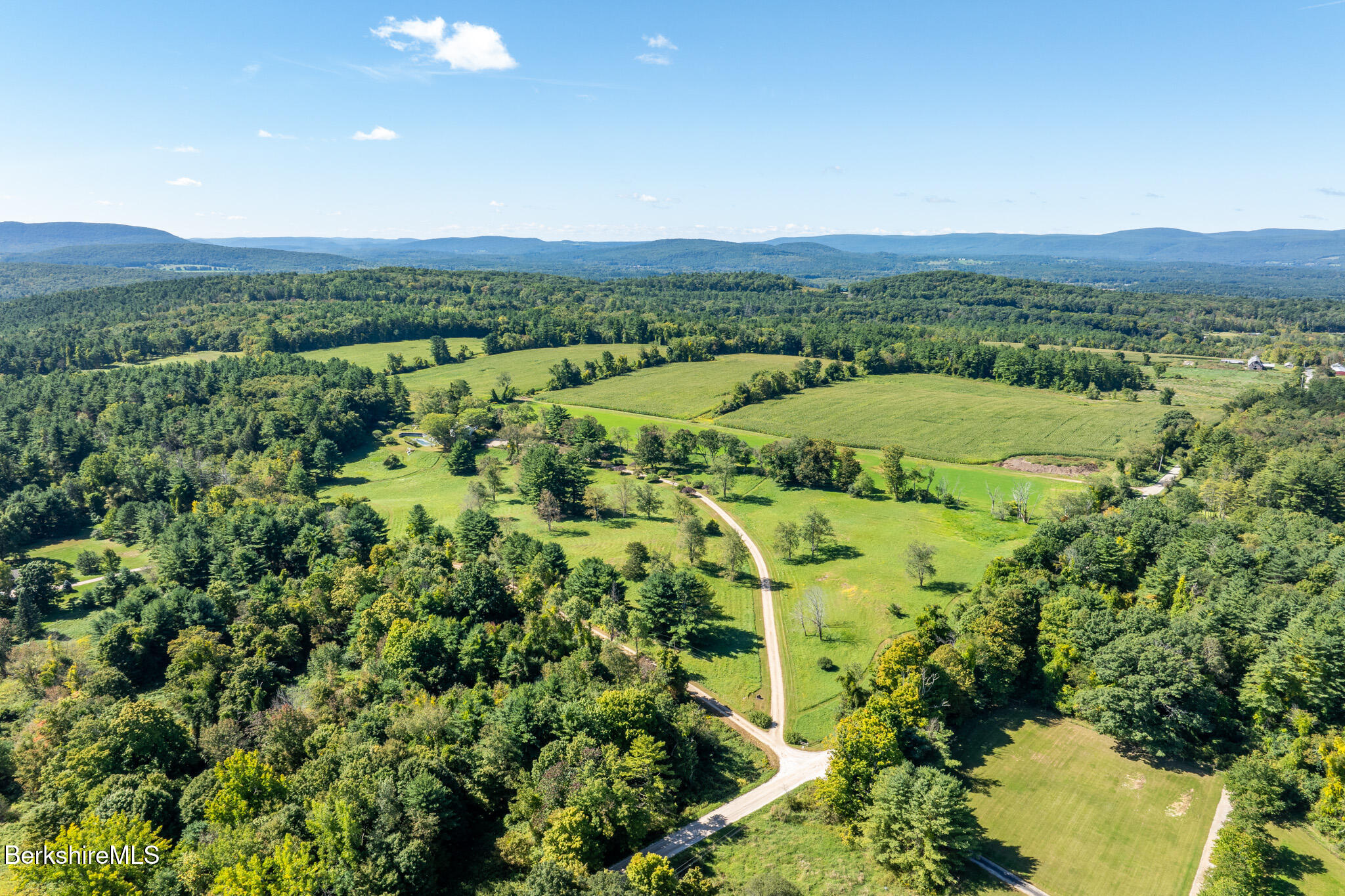 415 Brewer Branch Road New Marlborough, MA 01259 - Photo 55 of 65 a view of a city with lush green forest