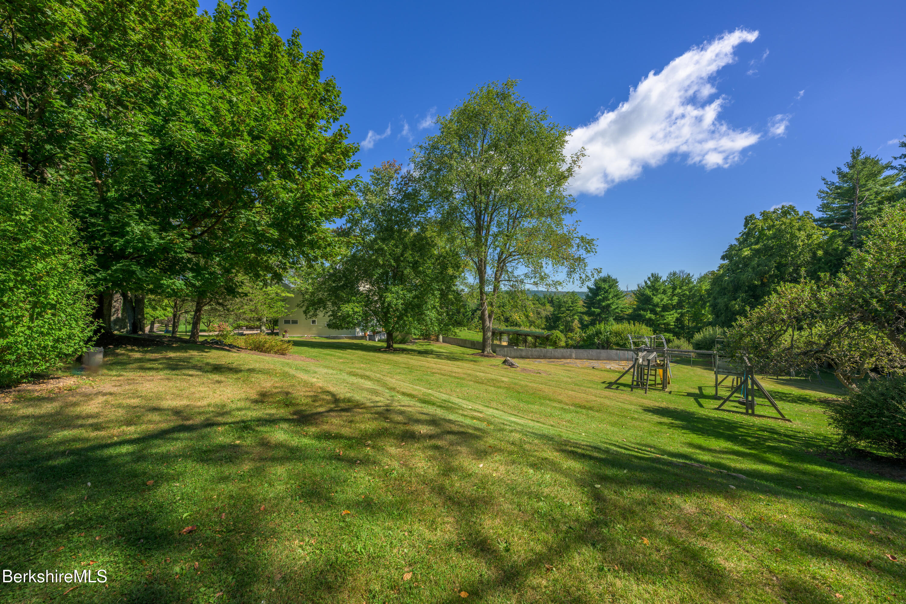 415 Brewer Branch Road New Marlborough, MA 01259 - Photo 57 of 65 a view of a golf course with a trees