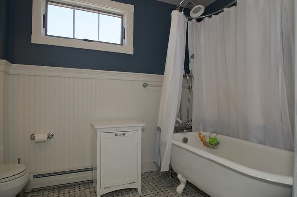 16 Beach Road Gloucester, MA 01930 - Photo 27 of 30 a bathroom with a bathtub a window and a shower