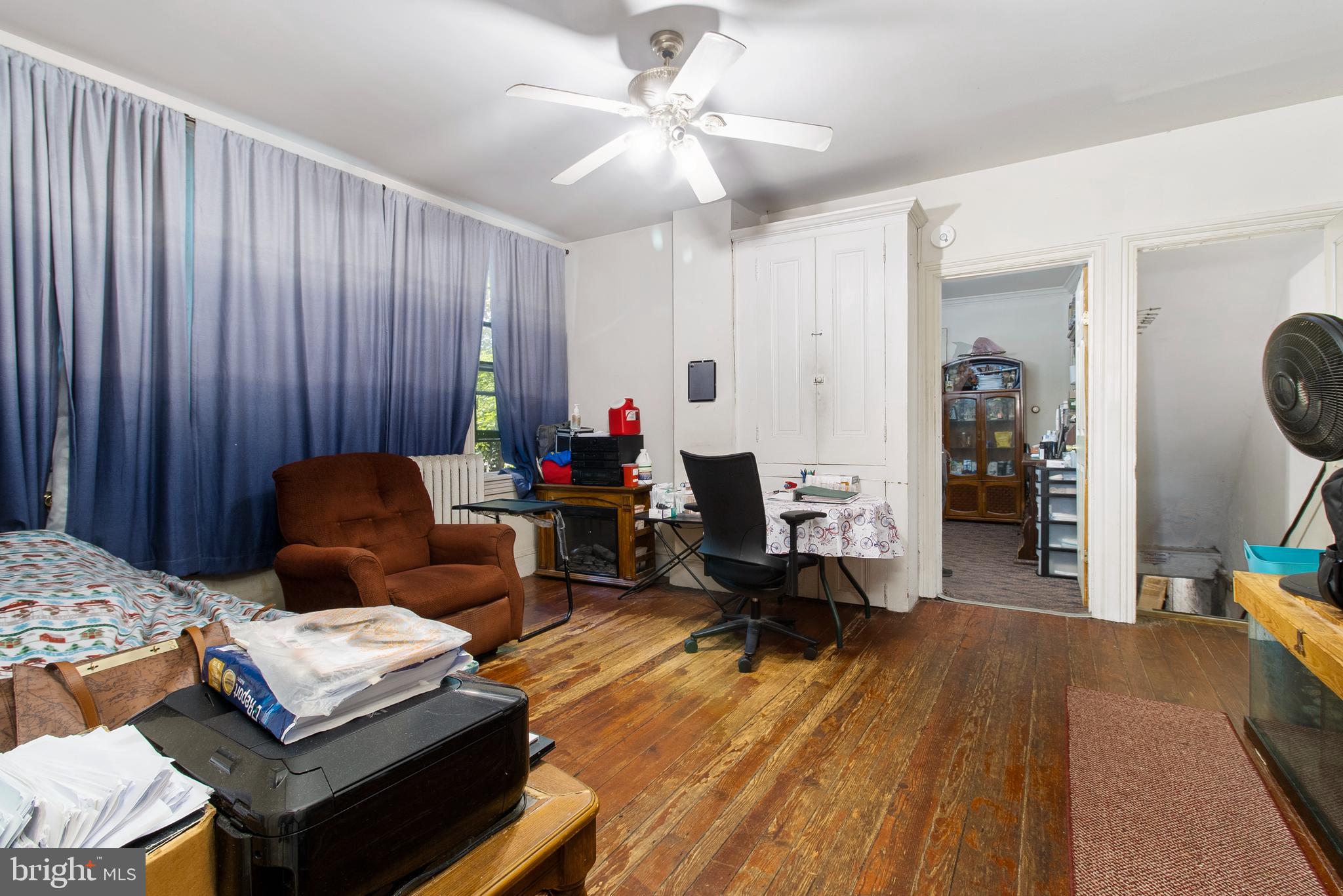 85 Madison Avenue Mount Holly, NJ 08060 - Photo 16 of 41 a living room with furniture and a wooden floor