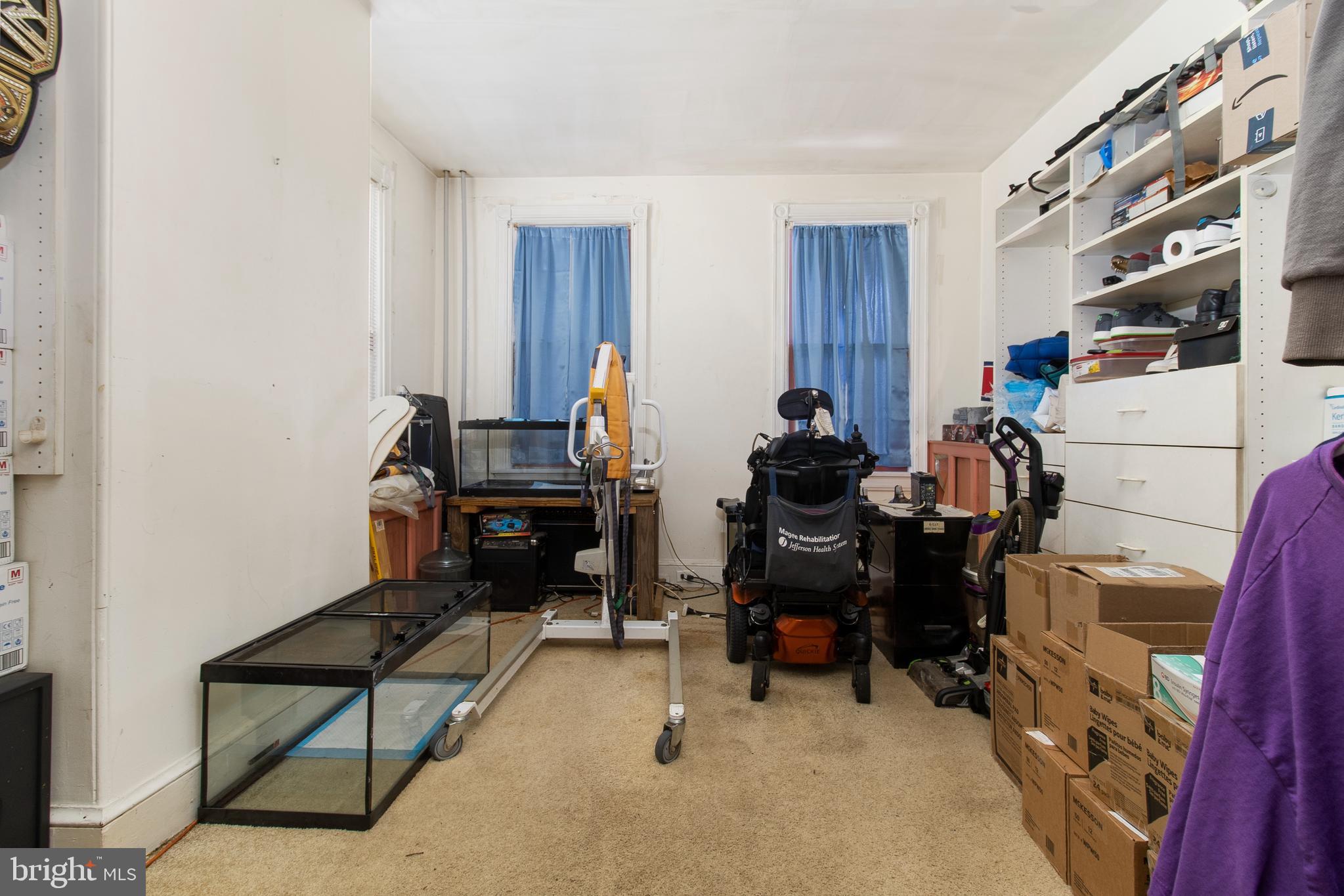 85 Madison Avenue Mount Holly, NJ 08060 - Photo 18 of 41 a room with furniture a rug and gym equipment