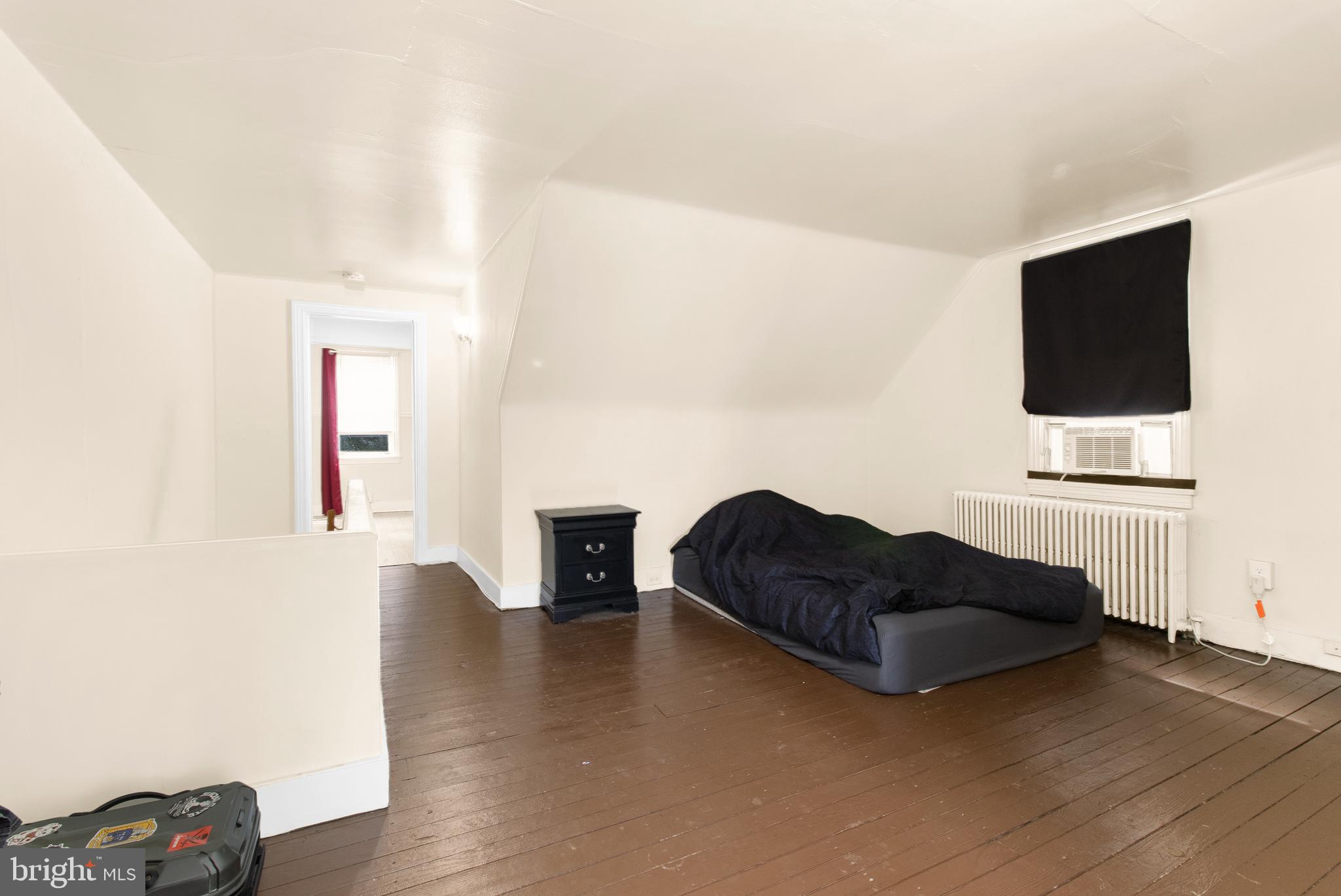 85 Madison Avenue Mount Holly, NJ 08060 - Photo 21 of 41 a living room with furniture and a flat screen tv