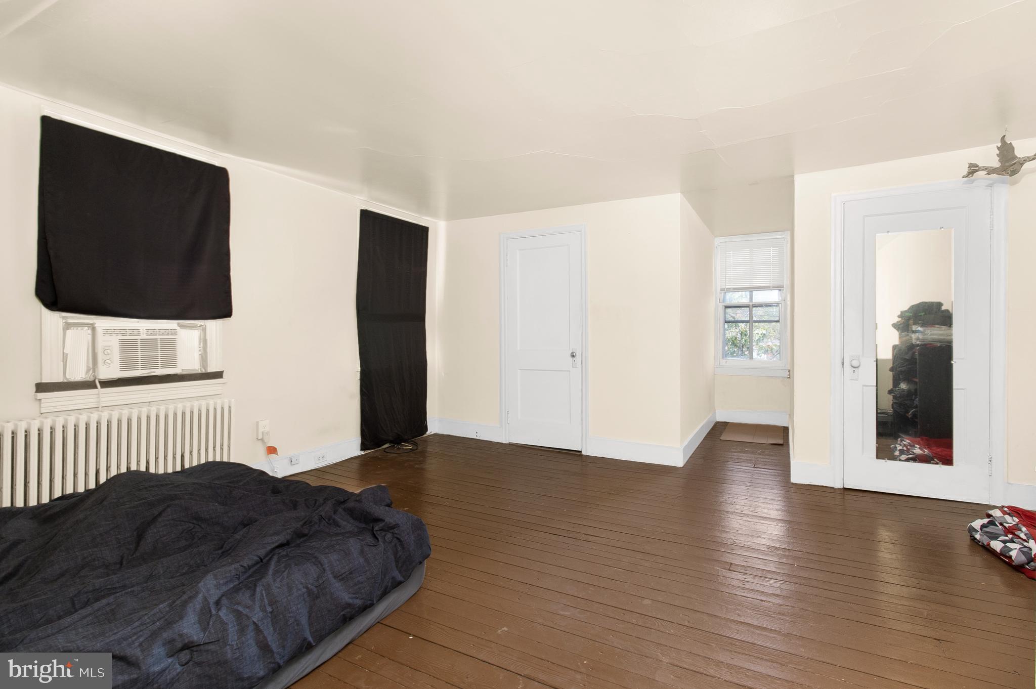85 Madison Avenue Mount Holly, NJ 08060 - Photo 23 of 41 a bedroom with a bed and a flat screen tv